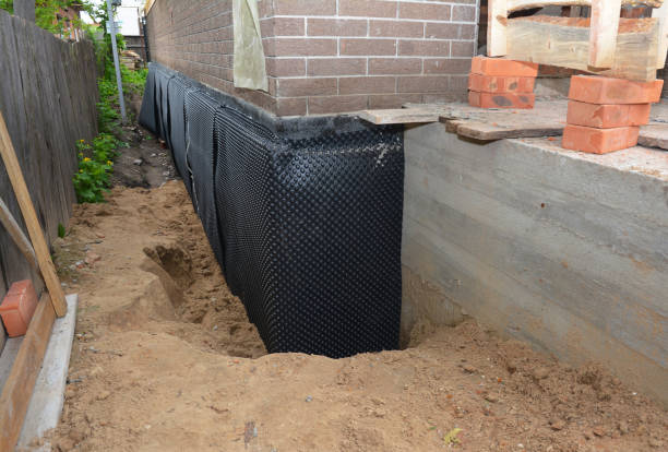 Happy homeowners after waterproofing job in Bayport